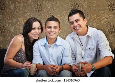 Joyful Native American Family Sitting Together Indoors