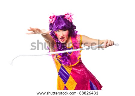 Joyful posing female clown making focus with rope on isolated white