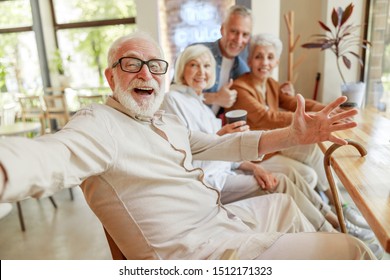 Joyful senior man spending time with friends stock photo - Powered by Shutterstock