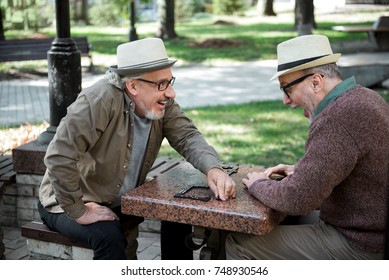 Joyful Senior Men Having Fun In Park