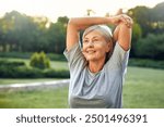 A joyful senior woman is gracefully stretching her arms outdoors in a lush, expansive green park, fully embracing a life of wellness, vitality, and the beauty of nature around her