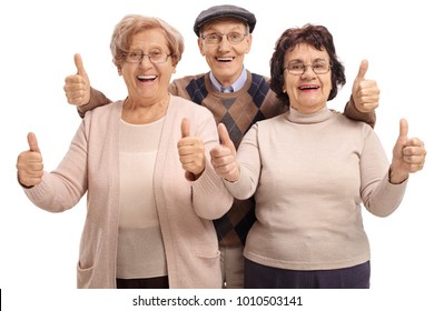Joyful seniors holding their thumbs up isolated on white background