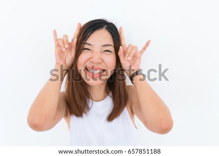 a joyful smiling asian girl with white undershirt is posing on the white background