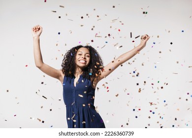 Joyful woman celebrating with falling confetti. Having fun, enjoying life, celebration - Shutterstock ID 2226360739