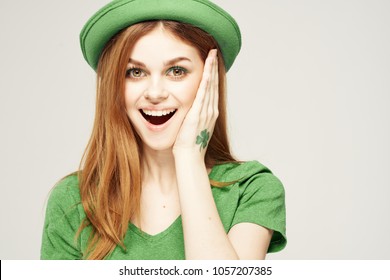  joyful woman with a clover on her hand, St. patrick's day                              