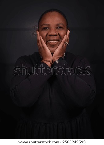 Similar – Image, Stock Photo Short-haired woman warms her hands with her breath in the autumn in the park