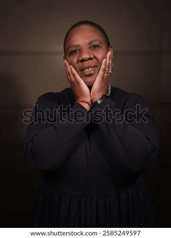 Similar – Image, Stock Photo Short-haired woman warms her hands with her breath in the autumn in the park