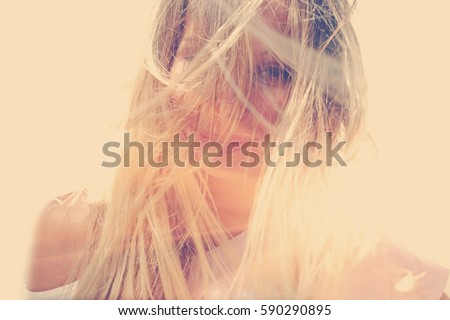 Image, Stock Photo Young woman at the stand blond hair blows around her