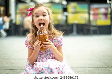 Joyful young girl with a pink bow and floral dress delightfully eating a large, colorful ice cream cone in an outdoor setting. - Powered by Shutterstock