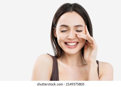 Joyful young woman close up beauty portrait, Beautiful joyful girl laughing and touching her face, isolated on grey background studio shot - Shutterstock ID 2149375805