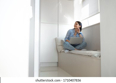 Joyful Young Woman Is Staying Indoors And Working Offline On Notebook Stock Photo. Website Banner