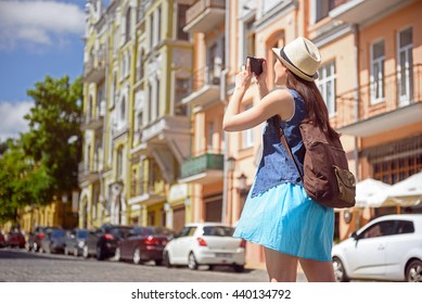 Joyful Young Woman Traveling Across City