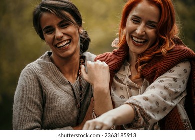 The joyous ambiance of a garden party, with a lesbian proposal with a diverse group of people relishing a shared meal amidst nature's beauty. - Powered by Shutterstock