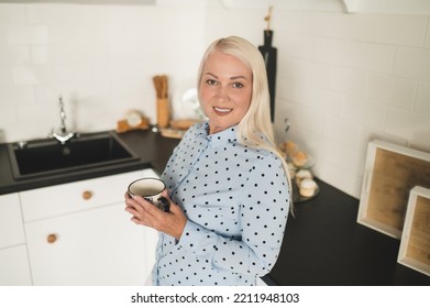 Joyous Mature Lady With A Coffee Cup