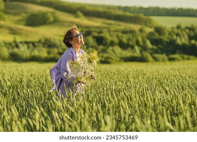 Joyous senior woman exploring a beautiful meadow, highlighting the appeal of nature tourism for seniors - Powered by Shutterstock