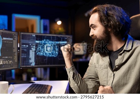 Joyous software developer celebrating after awakening sentient AI capable of human level of intelligence, IT professional delighted to interact with self aware sentient artificial intelligence.