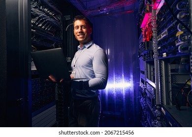 Joyous system administrator with laptop colocation data center