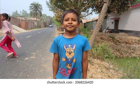 Joypurhat, Bangladesh- March 05, 2021: An Young Kid Wearing Blue Color T Shirt And Standing Straight