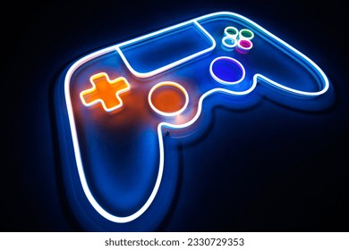 Joystick or gamepad, neon sign on the background of the wall. The concept of computer games - Powered by Shutterstock