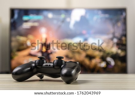 Joystick or gamepad on a table.Video game controller.