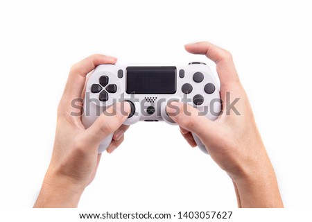 Joystick gaming controller in hand isolated on white background , Video game console developed Interactive Entertainment