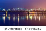 Jozef Pilsudski road bridge reflected in Vistula river. Torun, Poland. Europe.