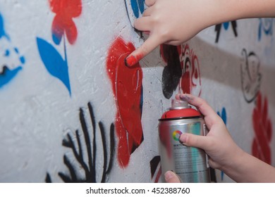 Jozefow, Poland - October 24, 2015:  The Girl With The Colour Spray Painting Mural