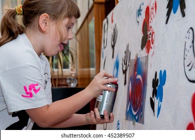 Jozefow, Poland - October 24, 2015:  The Girl With The Colour Spray Painting Mural