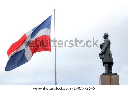 Juan Pablo Duarte next to the Dominican flag