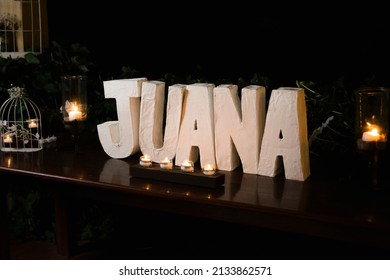 Juana In White Block Letters