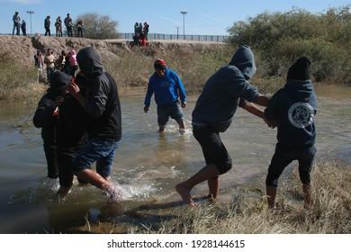 Juarez, Chihuahua, Mexico, 08-12-2018 group of Guatemalan migrants crosses the Rio Grande, the border between Mexico and the United States to try to request political asylum