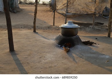 Juba, South Sudan, February 2017. Preparing Meal At A Salesian Camp For Internally Displaced Persons (IDPs). Pot On The Ground. Captured During Civil War.