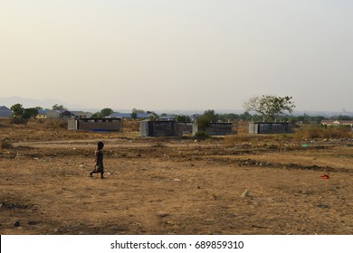 Juba, South Sudan, February 2017. Silhouette Of A Little Child Walking At A Salesian Camp For Internally Displaced Persons (IDPs). Captured During Civil War.