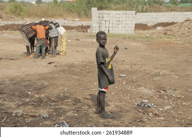 JUBA, SOUTH SUDAN - FEBRUARY 26: Unidentified Kids Play On A Street Of Juba On February 26, 2012 In Juba, South Sudan. Juba Is Full Of Refugees Who Live With Their Children In Appalling Conditions.