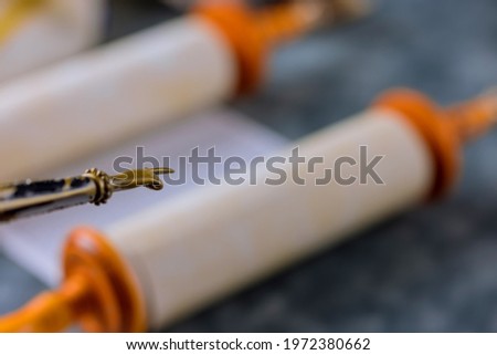 Judaic religion of Torah Scrolls with a pointer in a Jewish synagogue