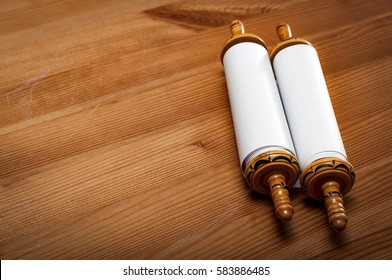 Judaism And Religious Text Concept With A Closed Torah On Wooden Background With Copy Space