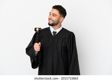 Judge Arab Man Isolated On White Background Looking To The Side And Smiling