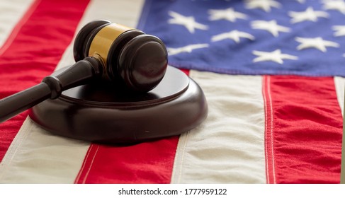 Judge Or Auction Gavel On United States Of America Flag Background. Justice And Law In USA Concept