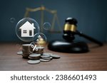 Judge Auctions and the Real Estate Legal System House model and hammer with icons on wooden table Laws governing foreclosures and bankruptcies, debts, or encumbrances.