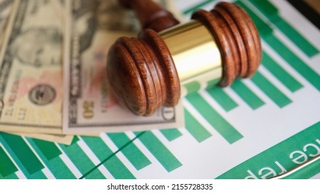 Judge Gavel With Banknotes On Business Financial Chart. Crime And Investigation And Business Fraud Concept