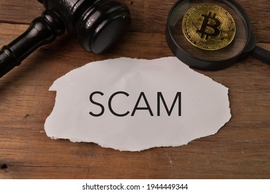 Judge Gavel, Golden Bitcoin And Torn Paper Written With SCAM.