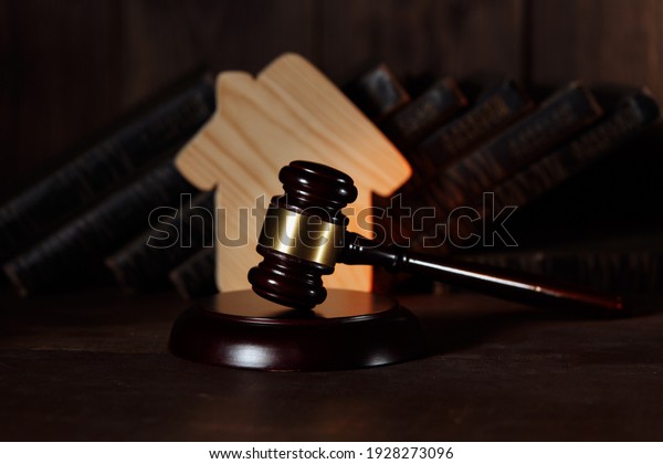 Judge gavel and house model at courtroom. Estate\
law and property auction\
concept