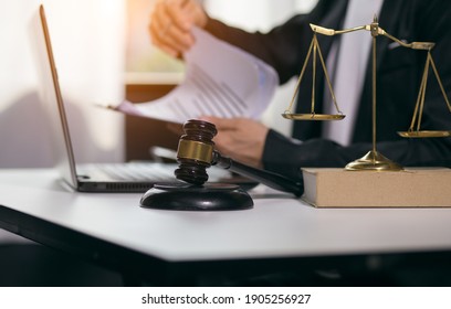 Judge gavel with Justice lawyers having team Concepts of Law and Legal services - Shutterstock ID 1905256927