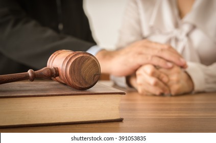 Judge Gavel ,law Books With Attorney Or Lawyer Provide Legal Advice And Consoling To His Clients In Background. Divorce Law ,Family Law Concept.