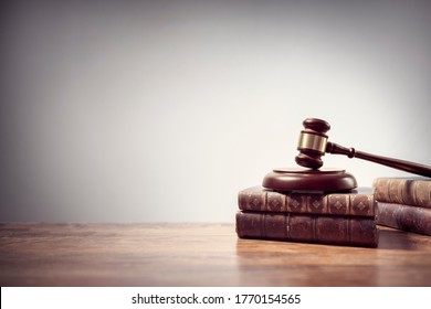 Judge gavel and law books in court, law and justice background concept with copy space