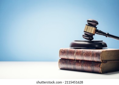 Judge gavel and law books in court, law and justice background concept with copy space - Powered by Shutterstock