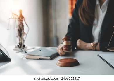 A judge with a gavel making a decision. Legal judgment and justice concept in a courtroom setting. - Powered by Shutterstock