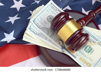 Judge Gavel And Money On United States Of America Flag. Many Hundred Dollar Bills Under Judge Malice On USA Flag. Judgement And Bribe