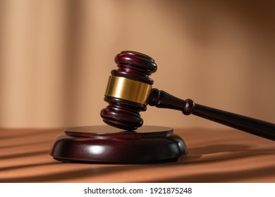 Judge gavel on a homogeneous background Justice and injustice, law - Shutterstock ID 1921875248
