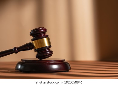 Judge gavel on a homogeneous background Justice and injustice, law - Shutterstock ID 1923050846